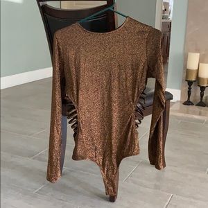Women’s glittery body suit.